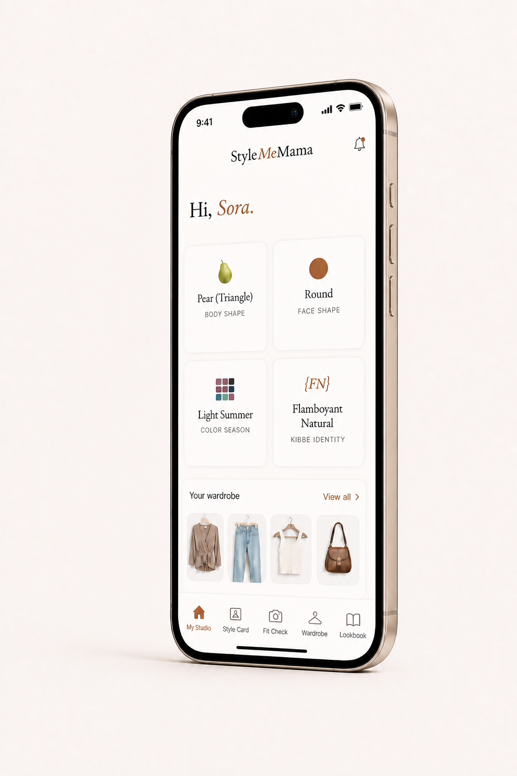 The StyleMeMama app's My Studio home screen on an iPhone, showing a personalized result: Pear (Triangle) body shape, Round face shape, Light Summer color season, and Flamboyant Natural Kibbe identity, with a wardrobe strip below.